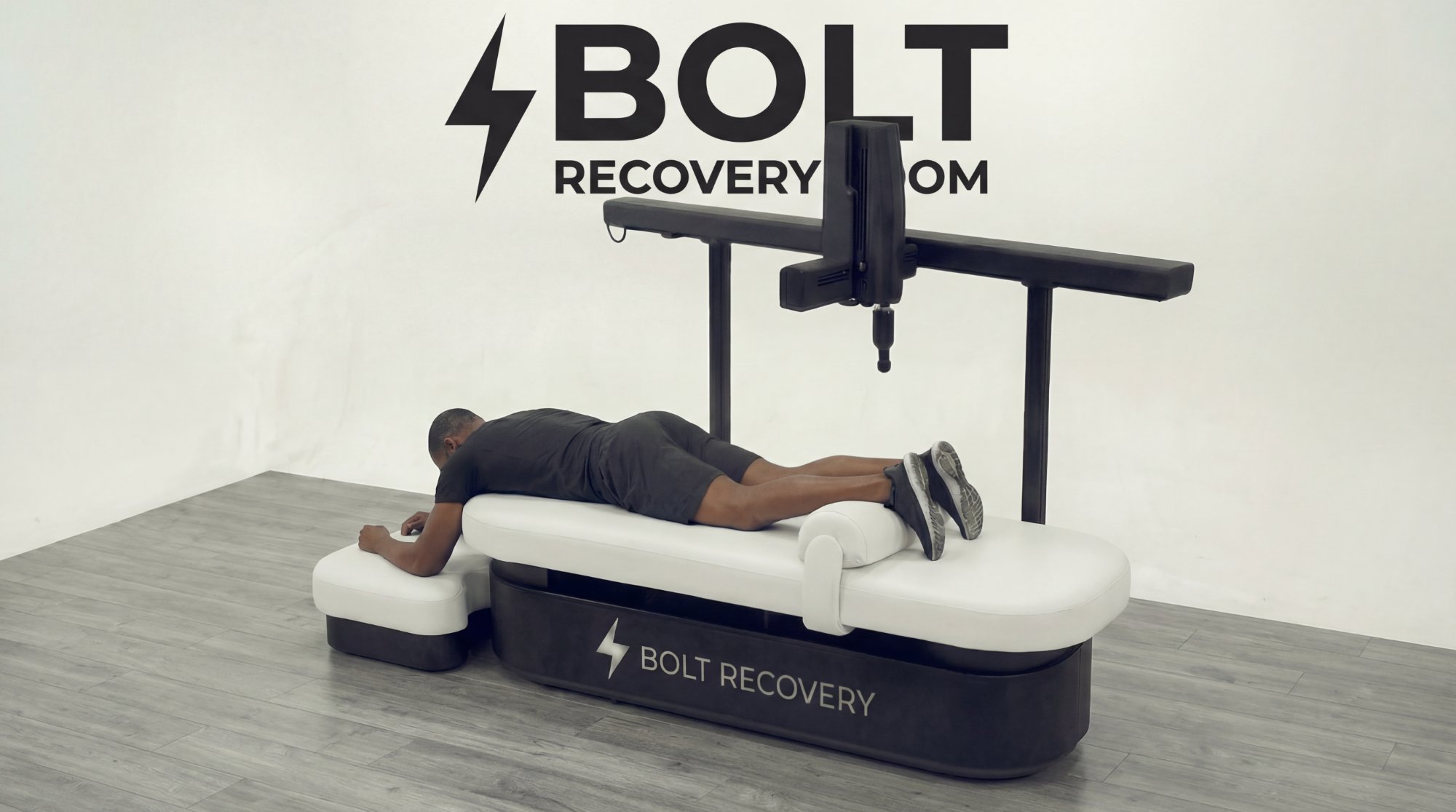 Bolt Recovery — full system with user, showing robotic arm and Bolt Recovery branding